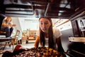 Woman Taking Burnt Pizza From Stove Royalty Free Stock Photo