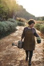 Woman taking care of the flowers at her countryside home Royalty Free Stock Photo