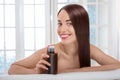 Woman taking care of hair in spa salon