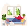 Woman taking care of houseplants housewife using laptop relaxing on sofa modern living room interior