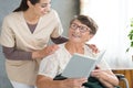 Smiling grandma reading book