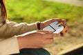 Woman taking cigarette out of pack outdoors, closeup Royalty Free Stock Photo