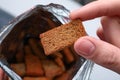 Woman taking crispy rusk out of package, closeup Royalty Free Stock Photo