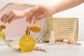 Woman taking crystal bottle of luxurious perfume from dressing table, closeup. Space for Royalty Free Stock Photo