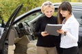 Woman taking delivery of her new car Royalty Free Stock Photo