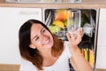 Woman Taking Drinking Glass From Dishwasher Royalty Free Stock Photo