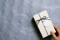 Woman taking gift box out of parcel