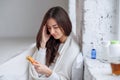 Woman taking medicine. Beautiful girl holding blister pack with pills in hand. Ill woman feels a headache and holds her Royalty Free Stock Photo