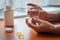 Woman is taking medicine or Omega 3 vitamin capsule Royalty Free Stock Photo