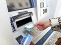 Woman taking money from an ATM
