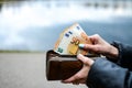 Woman is taking money from the purse Royalty Free Stock Photo