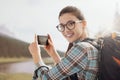 Woman taking nature photos with her phone Royalty Free Stock Photo