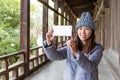 Woman taking photo with cellphone in japanese old house Royalty Free Stock Photo