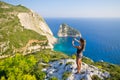 Woman taking photo of cliff - Zakynthos island, Agalas, Greece Royalty Free Stock Photo