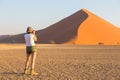 A woman taking a photo of the dunes, Sossusvlei, Namibia Royalty Free Stock Photo