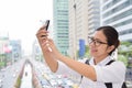 Woman taking photo with her smart phone. Royalty Free Stock Photo