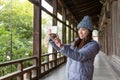 Woman taking photo in japanese architecture Royalty Free Stock Photo