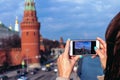 Woman taking photo of Kremlin, Russia, Moscow. Russian concept. Royalty Free Stock Photo