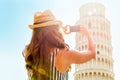 Woman taking photo of leaning tower of pisa, italy Royalty Free Stock Photo