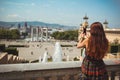 Woman taking the photo panorama mountain in Barcelona