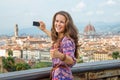 Woman taking photo of panoramic view of florence Royalty Free Stock Photo