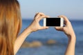 Woman taking photo with a smart phone camera