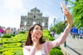 Woman taking photo by smart phone in Macau Royalty Free Stock Photo