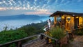 Woman taking a photo to morning mist at Phu Lang Ka, Phayao in Thailand