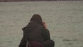 Woman taking a photos with dslr camera outdoors, on the beach