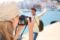 Woman taking photos of her boyfriend Royalty Free Stock Photo