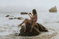 Woman taking photos with her phone on the beach Royalty Free Stock Photo