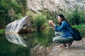 Woman taking picture of amazing nature view