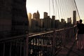 Woman taking a picture to Manhattan views at Brooklyn Bridge. Ne