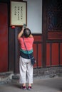 Woman taking pictures of chinese characters