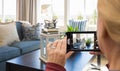 Woman Taking Pictures of A Living Room in Model Home with Her Smart Phone Royalty Free Stock Photo