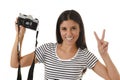 Woman taking pictures posing smiling happy using cool retro and vintage photo camera