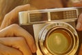 Woman taking pictures with vintage camera. Travel. Fall season