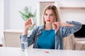 The woman taking pills to cope with pain Royalty Free Stock Photo