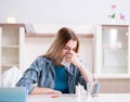 Woman taking pills to cope with pain Royalty Free Stock Photo