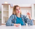 Woman taking pills to cope with pain Royalty Free Stock Photo