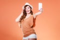 Woman taking self picture with smartphone camera Royalty Free Stock Photo