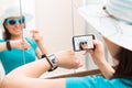 Woman taking self portrait selfie photo. Smartwatch concept.