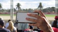 Woman taking a selfie in the crowd of Albert Park circuit, F1 Aus GP, Melbourne Royalty Free Stock Photo