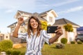 Woman taking a selfie with her new house keys Royalty Free Stock Photo