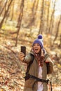 Woman taking a selfie while hiking in the forest Royalty Free Stock Photo