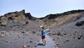 Woman taking a selfie inside the crater of El Cuervo volcano. Lanzarote. Canary Islands Royalty Free Stock Photo