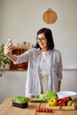 Woman taking selfie or makes a video lesson about cooking, on cellphone Royalty Free Stock Photo