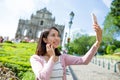 Woman taking selfie by mobile phone Royalty Free Stock Photo