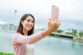 Woman taking selfie by mobile phone in Macau Royalty Free Stock Photo