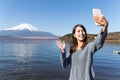 Woman taking selfie by mobile phone Royalty Free Stock Photo